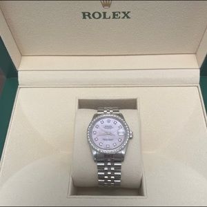 Women’s Rolex 31mm Pink MOP dial with Diamond indicators and a Diamond bezel